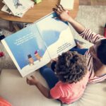 Mom reading picture book with her son