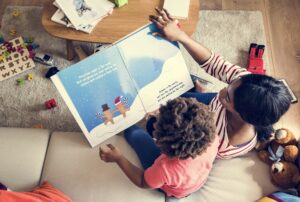 Mom reading picture book with her son