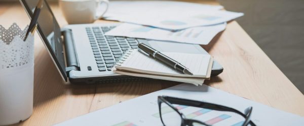 desk-office-with-marketing-graph-statistics-analysis-e1725446832143.jpg