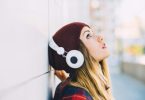 young woman outdoor listening music